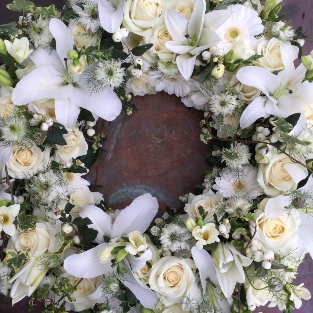 Funeral Flowers, Wreath with white flowers - lilies, roses and garden flowers