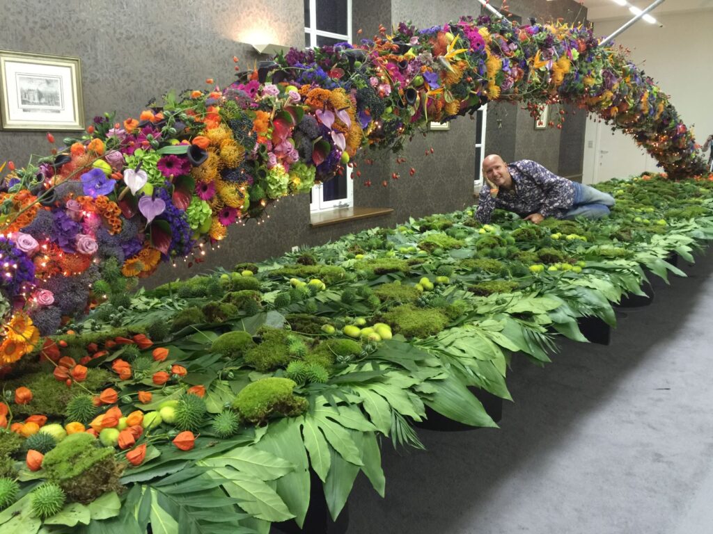 Flower decoration with flower arc above it