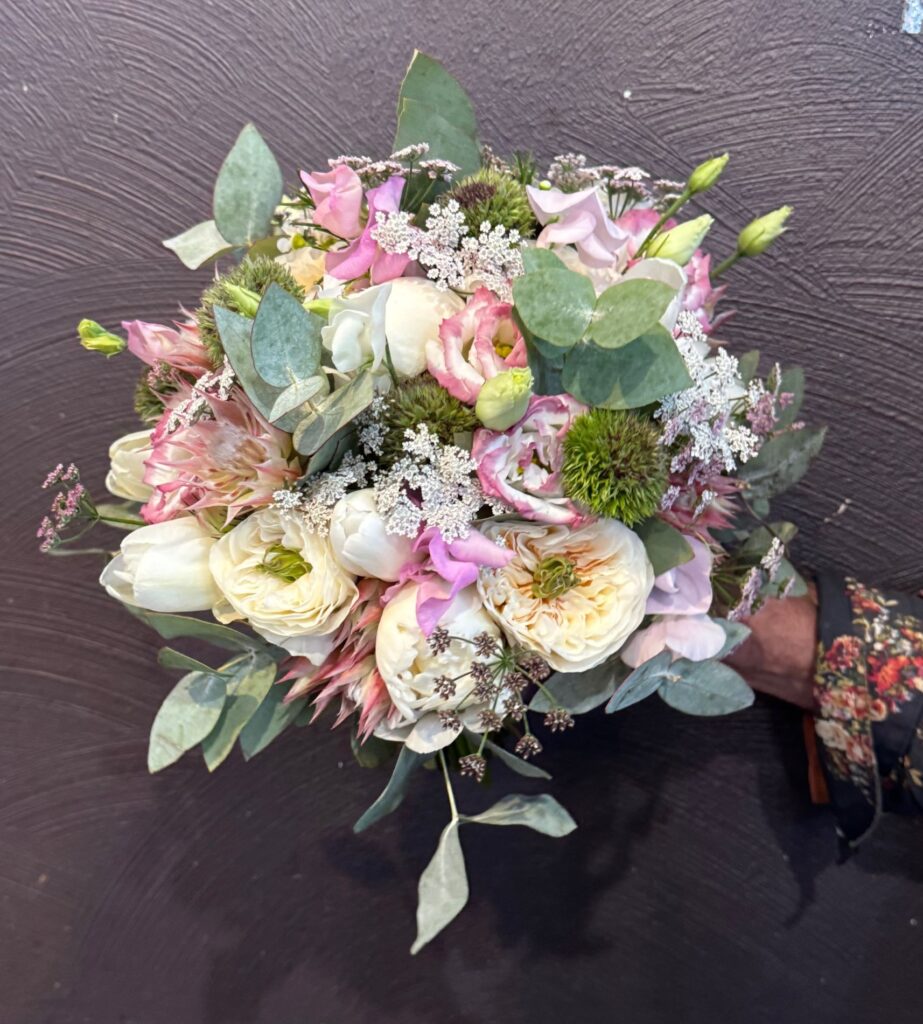 Pastel wedding bouquet with garden roses, eucalyptus and garden flowers
