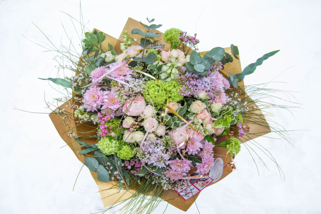 Romantic pastel flower bouquet with garden flowers and roses