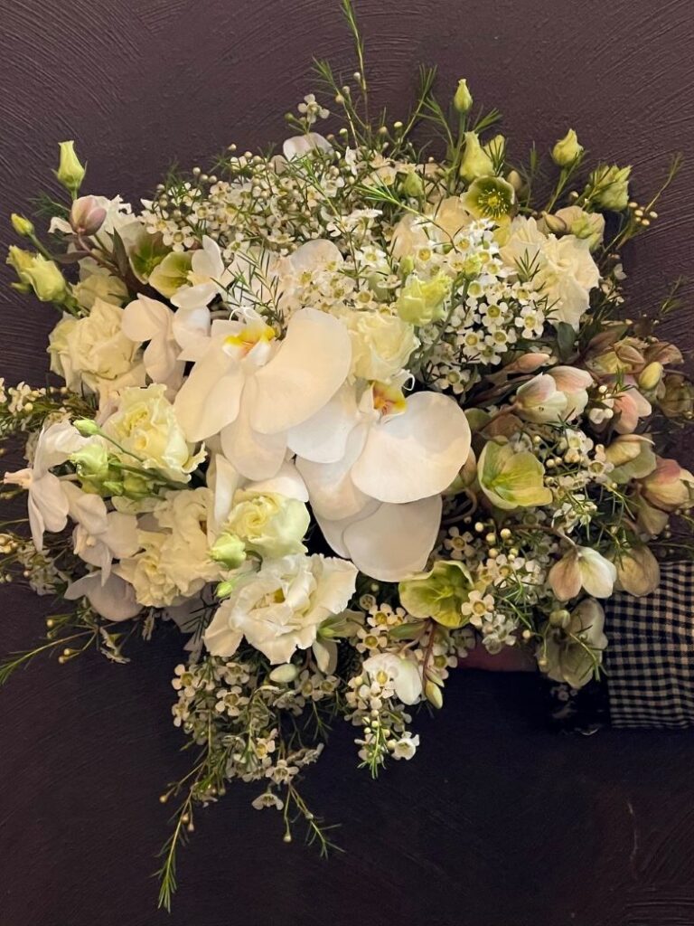 Round wedding bouquet with orchids and white and lime garden flowers