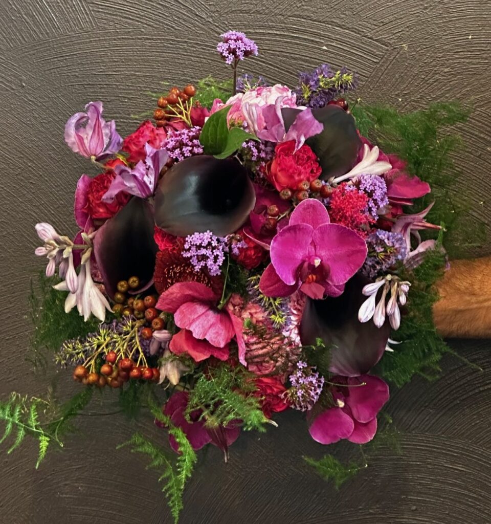 Magenta purple wedding bouquet with orchids